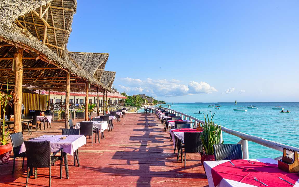 The Marina Grina restaurant deck reaching out over the turquoise sea at Amaan