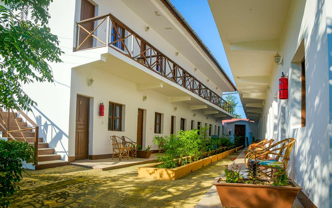 Pool-view rooms with private balconies around the courtyard at Amaan